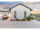 Backyard view showing neutral stucco and stone accents with outdoor seating at 2656 E Oriole Dr, Gilbert, AZ 85297