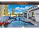 Expansive backyard featuring a luxurious pool, spa, water features, and ample seating at 2656 E Oriole Dr, Gilbert, AZ 85297