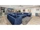 Finished basement featuring a large sectional sofa, game tables and plenty of space for recreation and relaxation at 2656 E Oriole Dr, Gilbert, AZ 85297