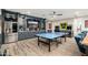 Basement entertainment area including a modern wet bar, a games area and stylish custom built-ins at 2656 E Oriole Dr, Gilbert, AZ 85297