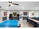 Spacious basement game room with an entertainment area and table tennis at 2656 E Oriole Dr, Gilbert, AZ 85297