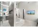 Spa-like bathroom with tiled shower, soaking tub, and modern finishes creates a serene retreat at 2656 E Oriole Dr, Gilbert, AZ 85297