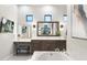 Stylish bathroom featuring vanity with makeup area, sleek wood cabinets, and modern mirror at 2656 E Oriole Dr, Gilbert, AZ 85297