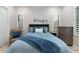 Cozy bedroom setting with a plush, blue-toned bedding arrangement at 2656 E Oriole Dr, Gilbert, AZ 85297