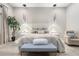 Lovely bedroom with neutral decor, contemporary lighting, and plush upholstered furniture at 2656 E Oriole Dr, Gilbert, AZ 85297
