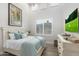 Bright bedroom with a plush bed, shuttered windows, and a modern TV for relaxing comfort at 2656 E Oriole Dr, Gilbert, AZ 85297
