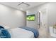 Cozy bedroom featuring a plush bed and an ensuite bathroom, with the window offering natural light at 2656 E Oriole Dr, Gilbert, AZ 85297