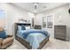Comfortable bedroom features neutral tones, a ceiling fan, and shuttered windows at 2656 E Oriole Dr, Gilbert, AZ 85297
