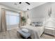 Bright primary bedroom with sleek, modern lighting, neutral decor and stylish furnishings at 2656 E Oriole Dr, Gilbert, AZ 85297