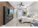 Beautiful bedroom featuring decorative wall, modern fireplace, and comfortable looking bed at 2656 E Oriole Dr, Gilbert, AZ 85297