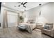 Well-lit bedroom featuring modern lighting fixtures, plush furniture, and beige accents at 2656 E Oriole Dr, Gilbert, AZ 85297