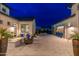 Beautiful courtyard with an outdoor seating area with an outdoor fireplace at 2656 E Oriole Dr, Gilbert, AZ 85297