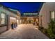 Elegant courtyard with stone flooring, textured accent wall, and cozy seating at 2656 E Oriole Dr, Gilbert, AZ 85297
