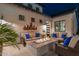 Beautiful courtyard with two outdoor seating areas surrounding an outdoor fireplace at 2656 E Oriole Dr, Gilbert, AZ 85297