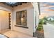 Home exterior with a tile patio, black trim windows, and manicured landscaping at 2656 E Oriole Dr, Gilbert, AZ 85297