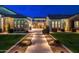 Beautiful walkway and manicured lawn leading to the front entrance of a well-lit home at 2656 E Oriole Dr, Gilbert, AZ 85297