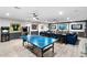 Spacious game room features a ping pong table, bar area, comfortable seating and games at 2656 E Oriole Dr, Gilbert, AZ 85297