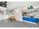 Garage features slat wall organization system, overhead racks, and room for workshop at 2656 E Oriole Dr, Gilbert, AZ 85297