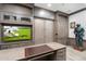Charming home office with integrated entertainment space and custom features, blending work and leisure at 2656 E Oriole Dr, Gilbert, AZ 85297