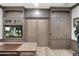 Elegant home office showcasing custom built-ins and entertainment options, perfect for a work-life balance at 2656 E Oriole Dr, Gilbert, AZ 85297