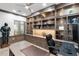 Custom home office featuring built-in shelving and storage, creating a functional and stylish workspace at 2656 E Oriole Dr, Gilbert, AZ 85297