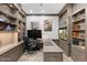 Elegant home office with custom cabinetry and a built-in entertainment area for relaxation and focus at 2656 E Oriole Dr, Gilbert, AZ 85297