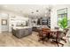 Open-concept kitchen featuring stainless steel appliances and a large island adjoining the dining and Gathering rooms at 2656 E Oriole Dr, Gilbert, AZ 85297