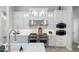 Modern kitchen with stainless steel appliances, custom cabinets, and elegant backsplash at 2656 E Oriole Dr, Gilbert, AZ 85297