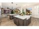 Spacious kitchen features dual islands, modern lighting, and seamless connectivity to the living area at 2656 E Oriole Dr, Gilbert, AZ 85297