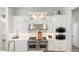 Gourmet kitchen featuring stainless steel appliances, custom cabinets, and backsplash at 2656 E Oriole Dr, Gilbert, AZ 85297