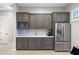 Charming kitchenette features modern appliances, sink, and dark wood cabinetry at 2656 E Oriole Dr, Gilbert, AZ 85297