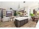 Bright living room with an open floor plan, stone accent wall, and sliding doors to the backyard at 2656 E Oriole Dr, Gilbert, AZ 85297