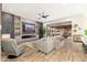 Comfortable Gathering room with a modern fireplace, built-in shelving and large sliding glass doors to the yard at 2656 E Oriole Dr, Gilbert, AZ 85297
