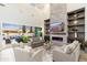 Soaring ceilings and oversized sliding doors accentuate this modern, stylish living room at 2656 E Oriole Dr, Gilbert, AZ 85297