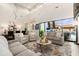 Bright, open living room with high ceilings, large windows, and access to outdoor pool area at 2656 E Oriole Dr, Gilbert, AZ 85297