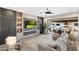Inviting living room with contemporary media center, fireplace, and open access to outdoor patio at 2656 E Oriole Dr, Gilbert, AZ 85297