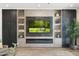 Cozy living room highlighting the sleek entertainment center and modern fireplace at 2656 E Oriole Dr, Gilbert, AZ 85297