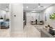 Open concept living area with hardwood floors leading to the primary bedroom at 2656 E Oriole Dr, Gilbert, AZ 85297