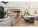Open living area with backyard access, light gray sofa and hardwood floors create a welcoming atmosphere at 2656 E Oriole Dr, Gilbert, AZ 85297