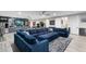 Cozy living room with a large comfortable sofa and a recreational area featuring a pool table at 2656 E Oriole Dr, Gilbert, AZ 85297