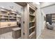 View of a home office through a hidden bookshelf doorway at 2656 E Oriole Dr, Gilbert, AZ 85297