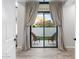Cozy patio with sliding glass doors, wicker chairs, and neutral colored curtains at 2656 E Oriole Dr, Gilbert, AZ 85297