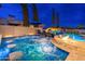 Beautiful pool with a spa, rock waterfall with slide, and luxurious lounge chairs, perfect for relaxing at 2656 E Oriole Dr, Gilbert, AZ 85297