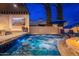 Luxurious pool with a built-in spa, fire pit, stepping stones, and a bar with outdoor tv at 2656 E Oriole Dr, Gilbert, AZ 85297