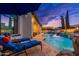 Luxurious pool featuring a spa with stepping stones, waterfall, outdoor kitchen and fire features at 2656 E Oriole Dr, Gilbert, AZ 85297