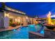 Gorgeous backyard with a pool, outdoor seating area, and outdoor kitchen, perfect for entertaining at 2656 E Oriole Dr, Gilbert, AZ 85297