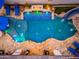 An aerial view of a unique pool with water features and lounge chairs at 2656 E Oriole Dr, Gilbert, AZ 85297