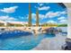 Beautiful backyard pool with a built-in slide, water features, and comfortable lounging areas at 2656 E Oriole Dr, Gilbert, AZ 85297