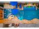 Aerial view of a luxury backyard pool and lounge area with a waterfall at 2656 E Oriole Dr, Gilbert, AZ 85297