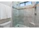 Detailed view of the tile shower showcasing mosaic tile accents and built-in seat at 2656 E Oriole Dr, Gilbert, AZ 85297